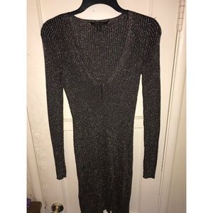 Black and gold long-sleeved cocktail dress